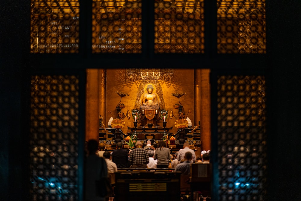 people praying inside building