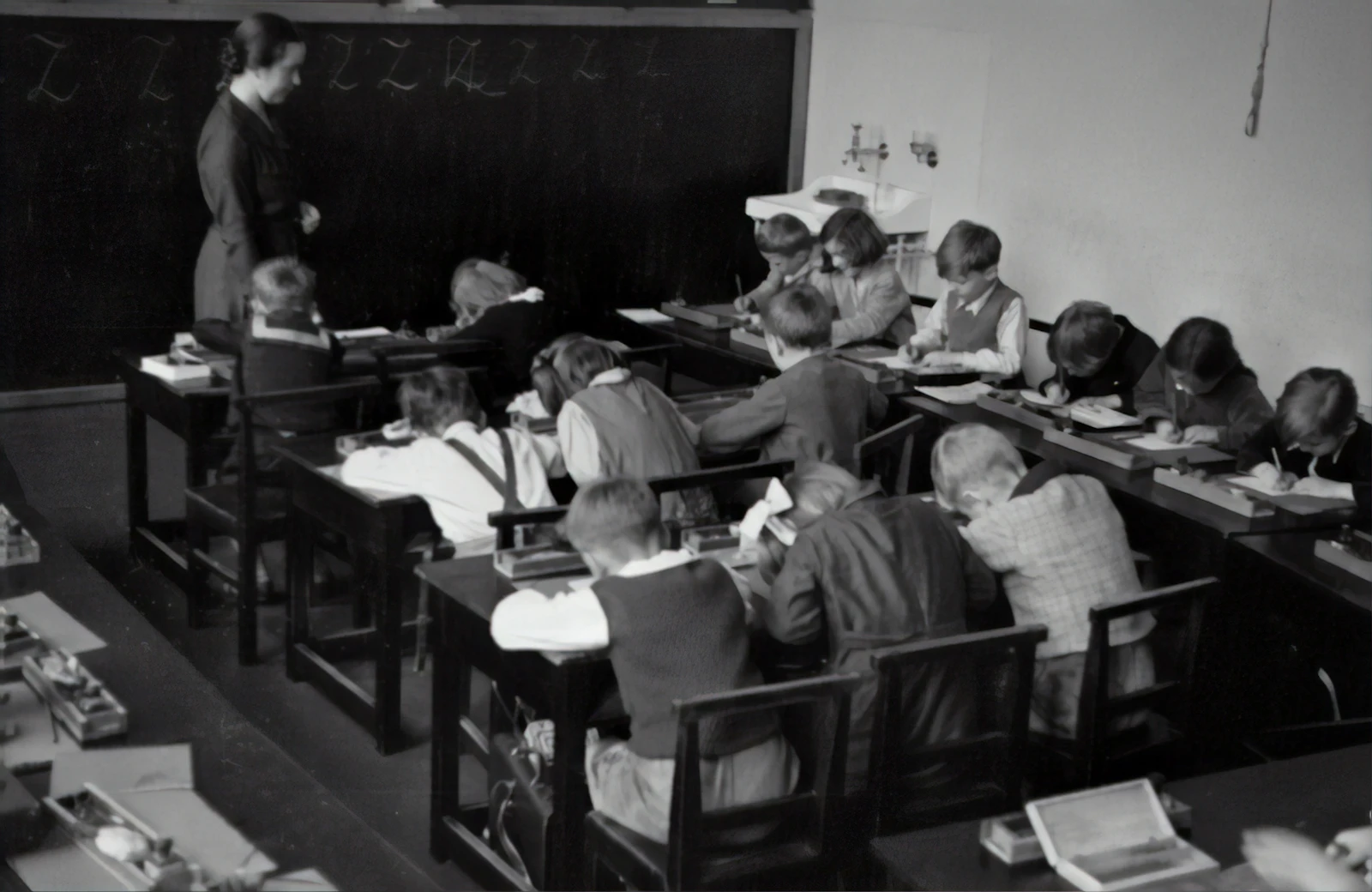 Teacher at the chalkboard with a primary class
