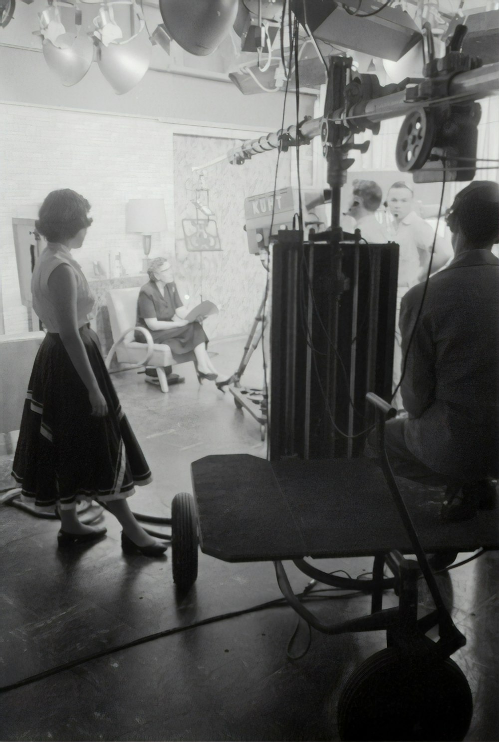 grayscale photography of people inside studio