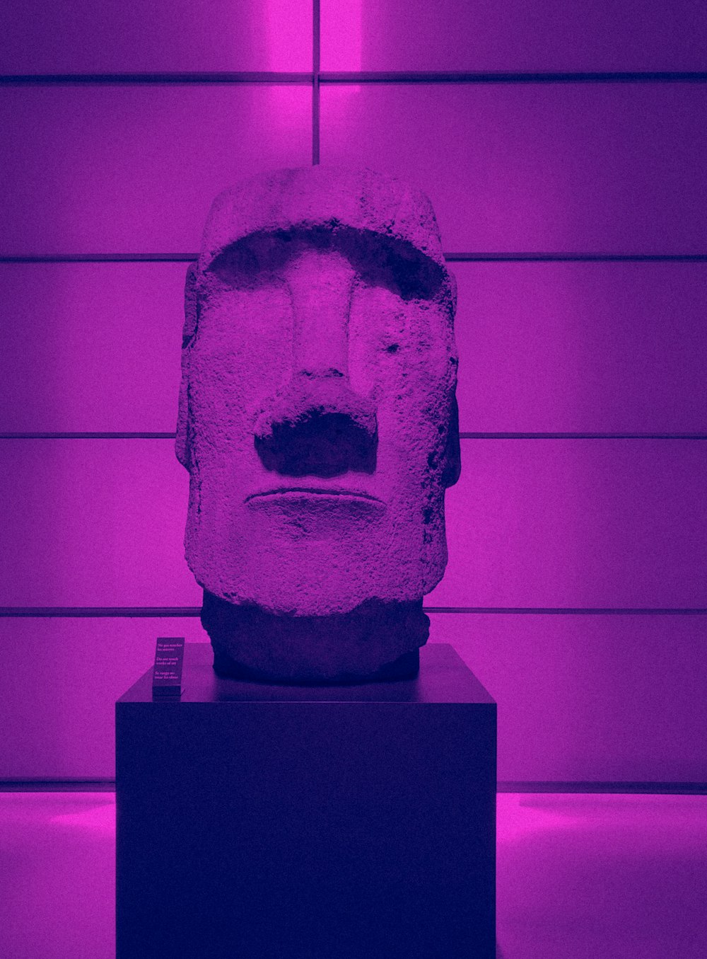 gray stone face designed statue