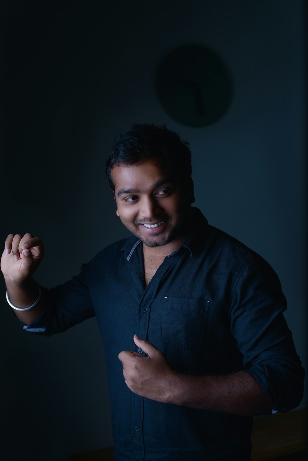 smiling man wearing black dress shirt