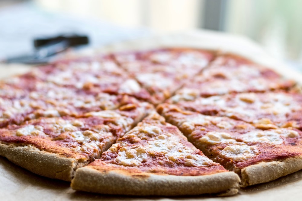 selective focus photography of sliced pizza