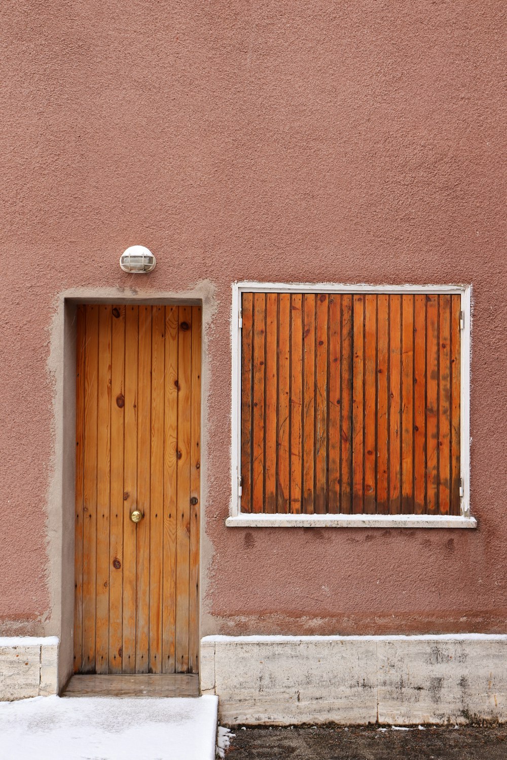 closed brown wooden door during daytime
