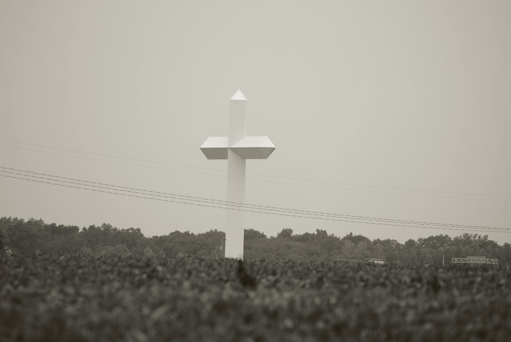 grayscale photo of wooden cross