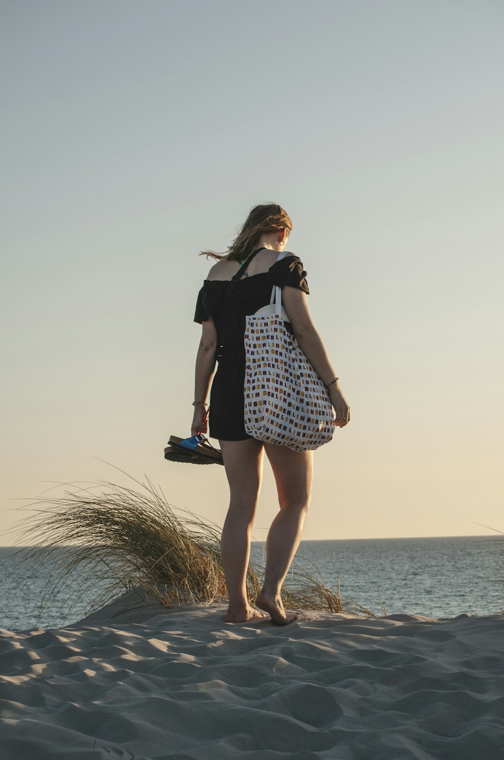 woman walking on sand