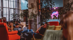 men sitting on sofa using laptop computers