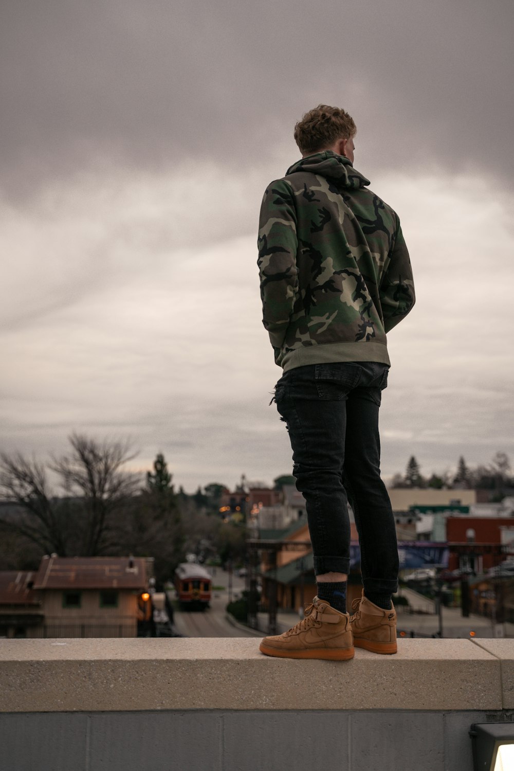 man standing on building top