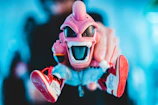 Close-up of a colorful 3D printed politically incorrect toy with bold details.