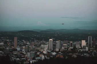 A cinematic aerial shot of a bustling cityscape captured by a drone.