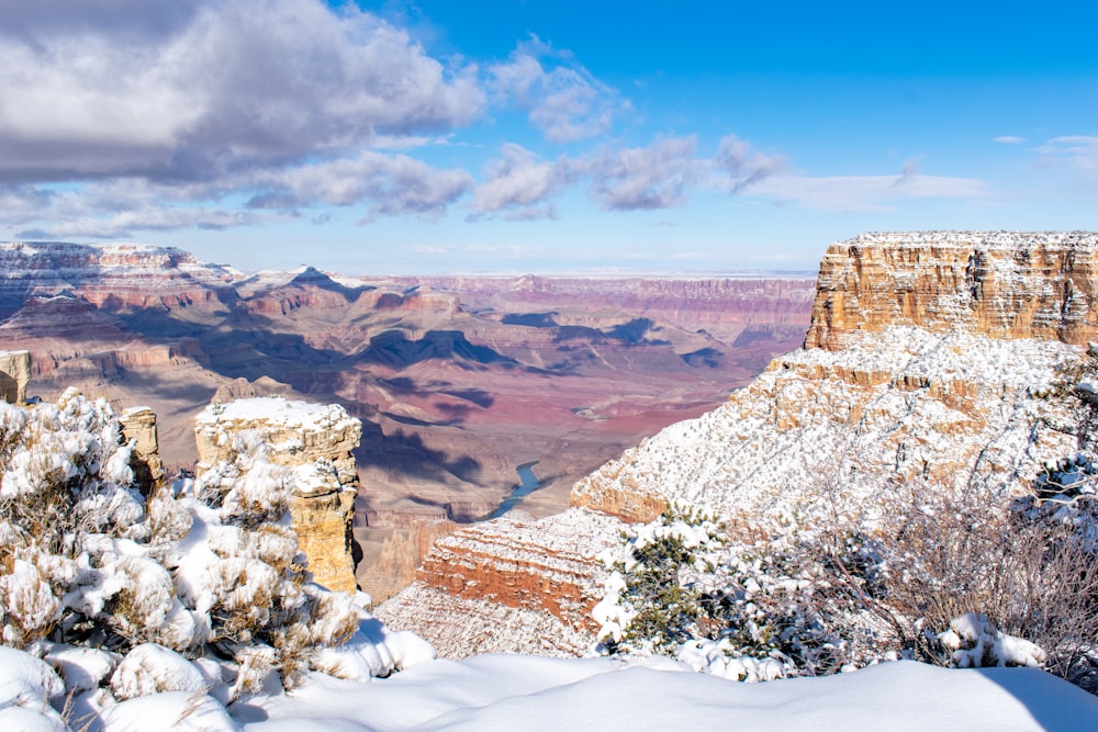 photography of snow-covered butte during daytime