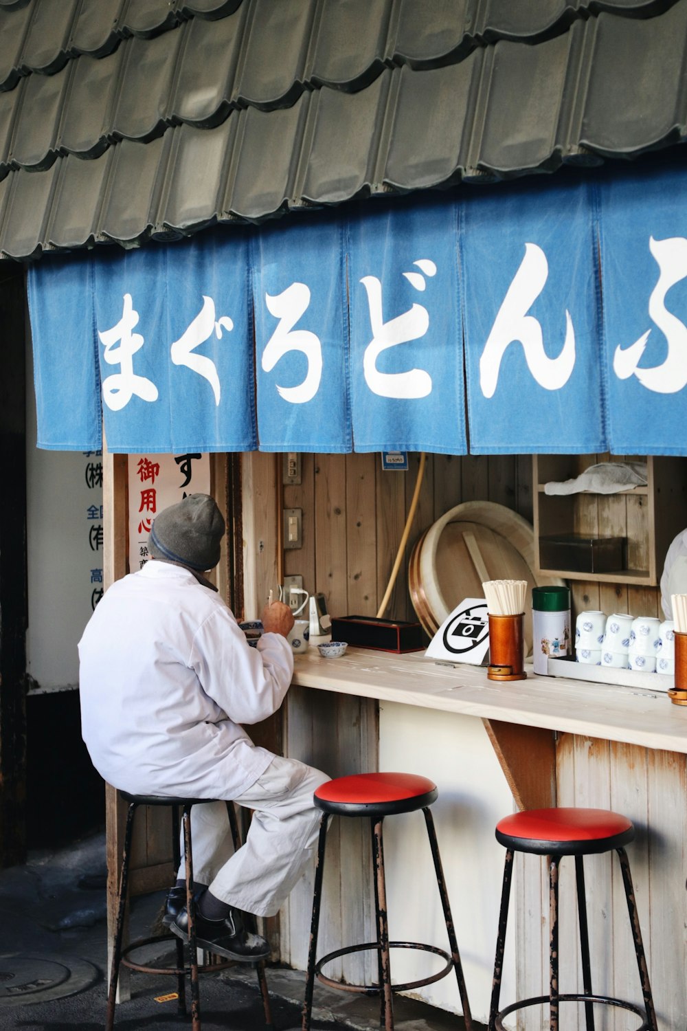 person sitting on bar stool