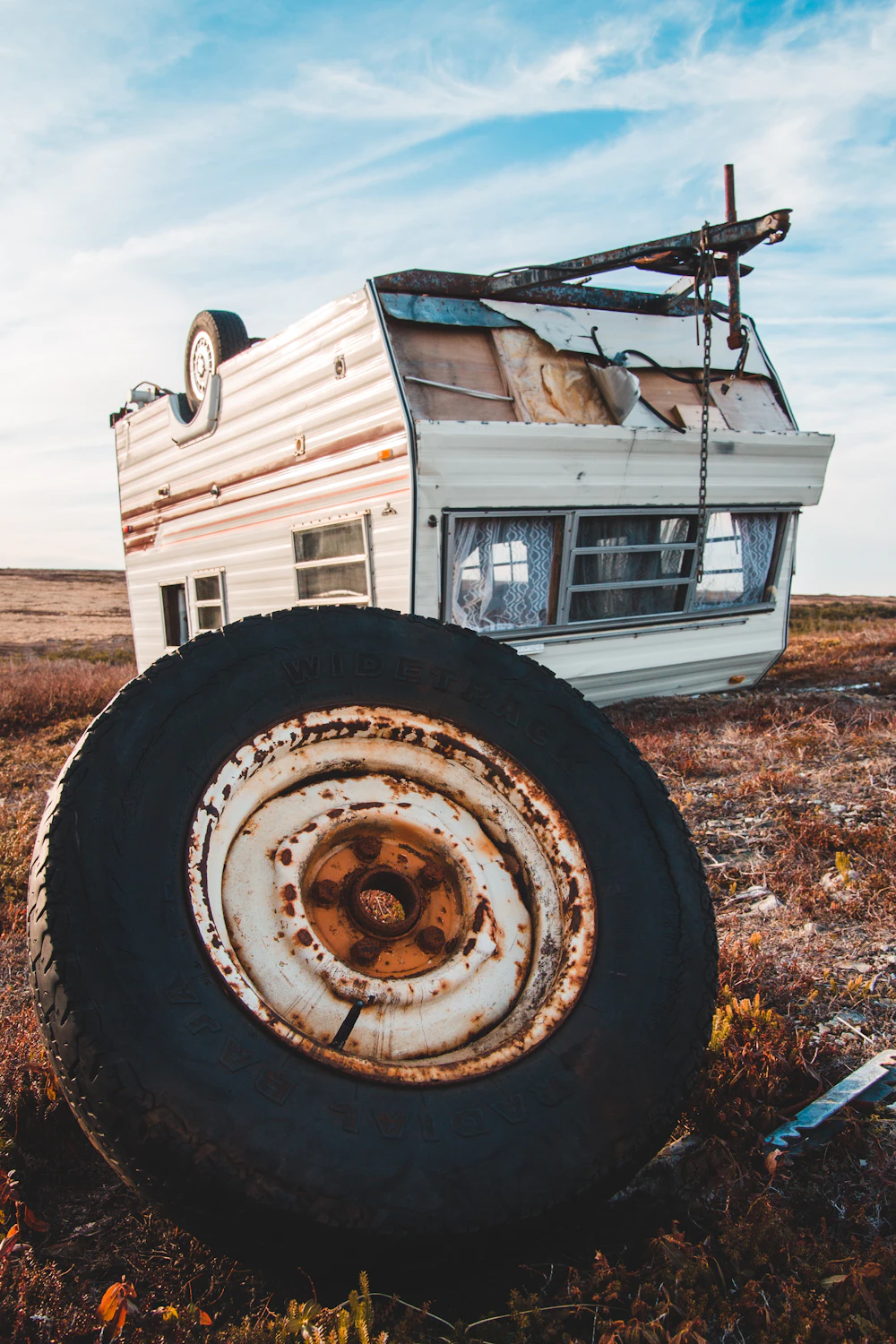 Storm-damaged trailer sitting on a lot awaiting removal