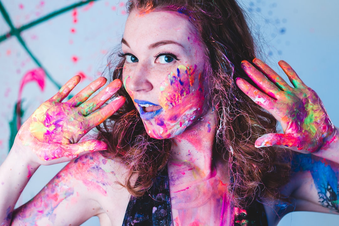 woman full of paints on hands