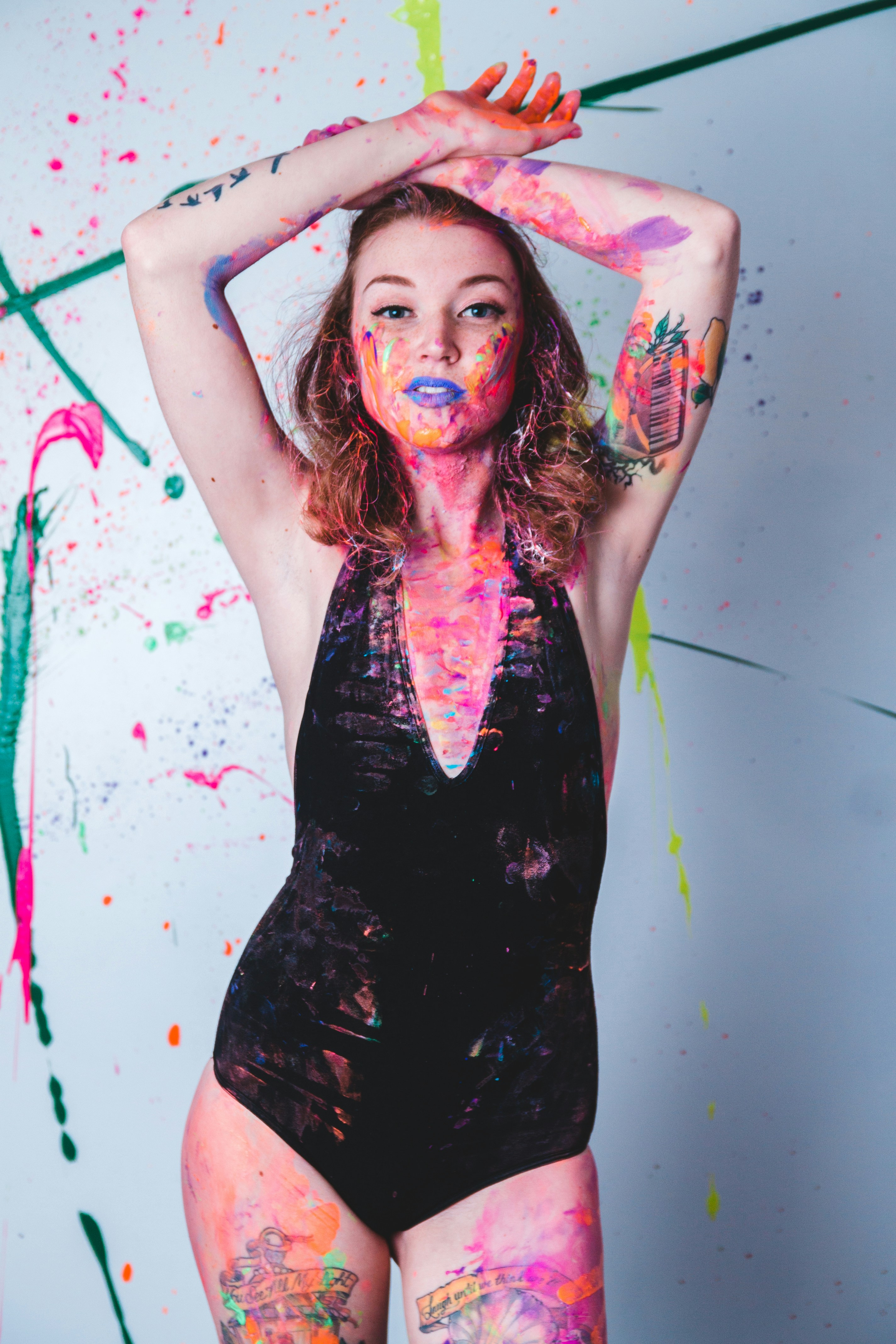 A woman in a bodysuit covered in paint photo Free Skin Image on Unsplash