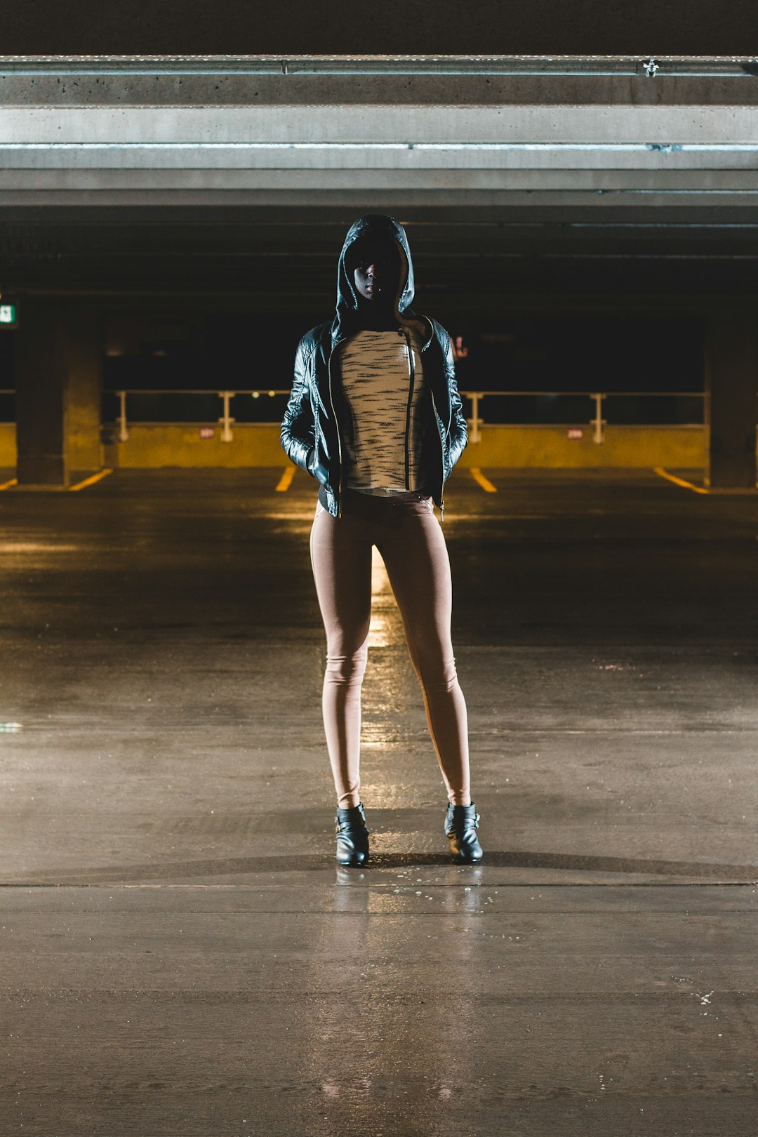 woman in hoodie standing on hallway