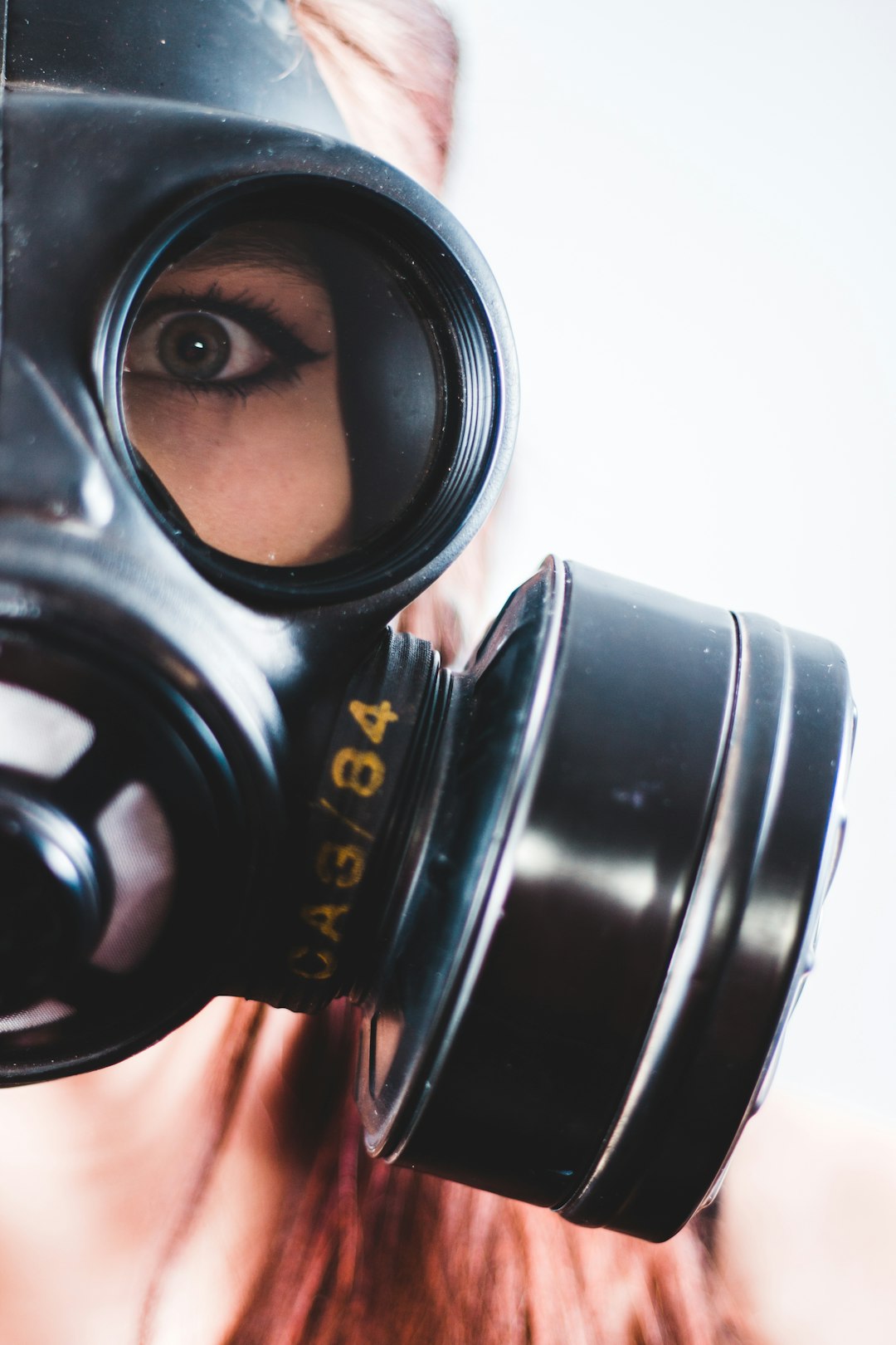 woman wearing black gas mask