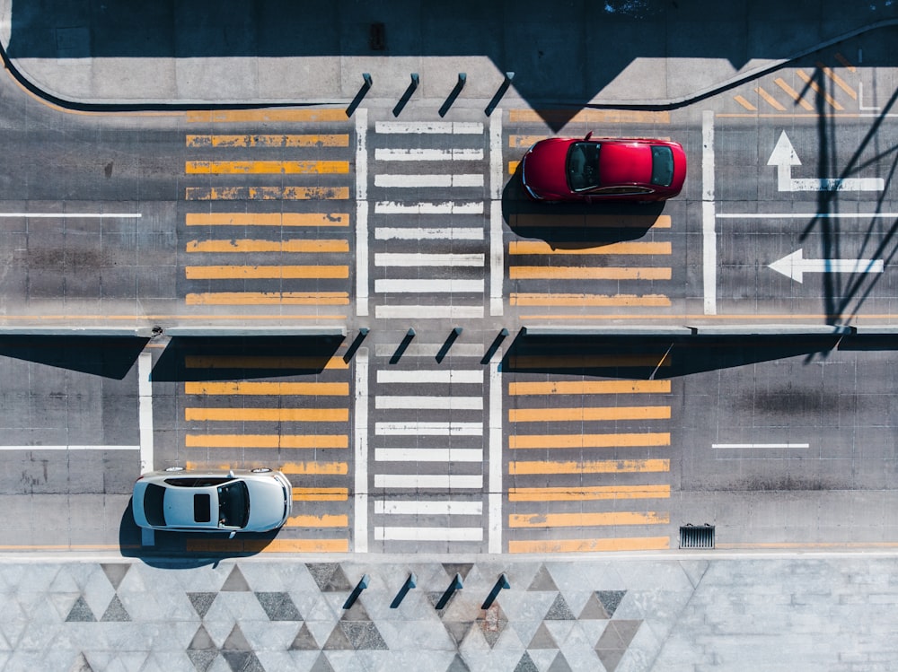 red and grey car on road