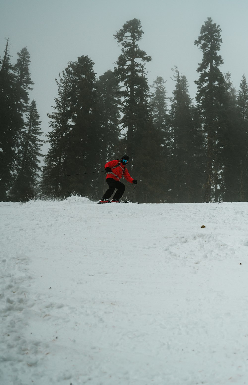 man skiing on hill covered with ice