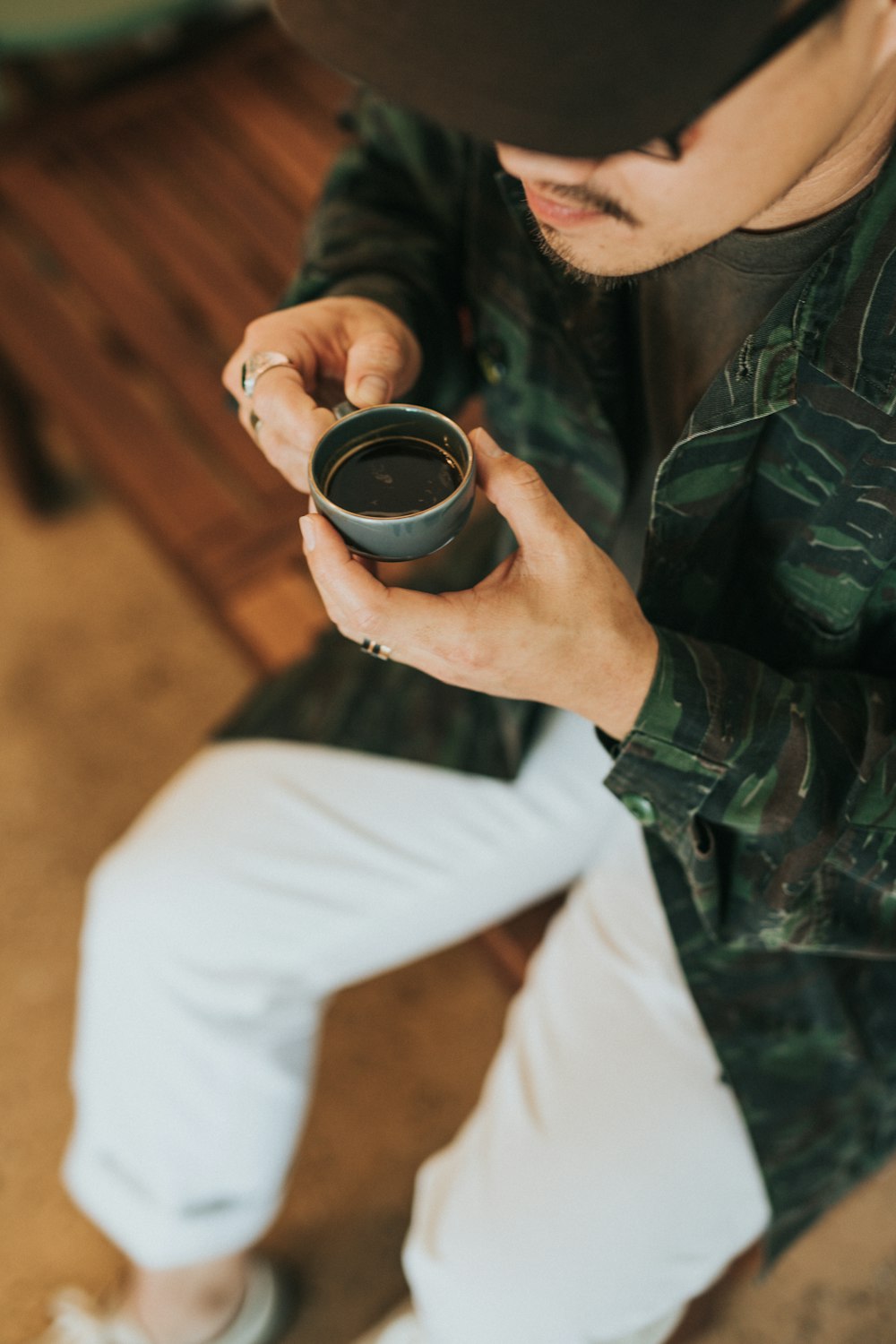 men's green and black camouflage jacket