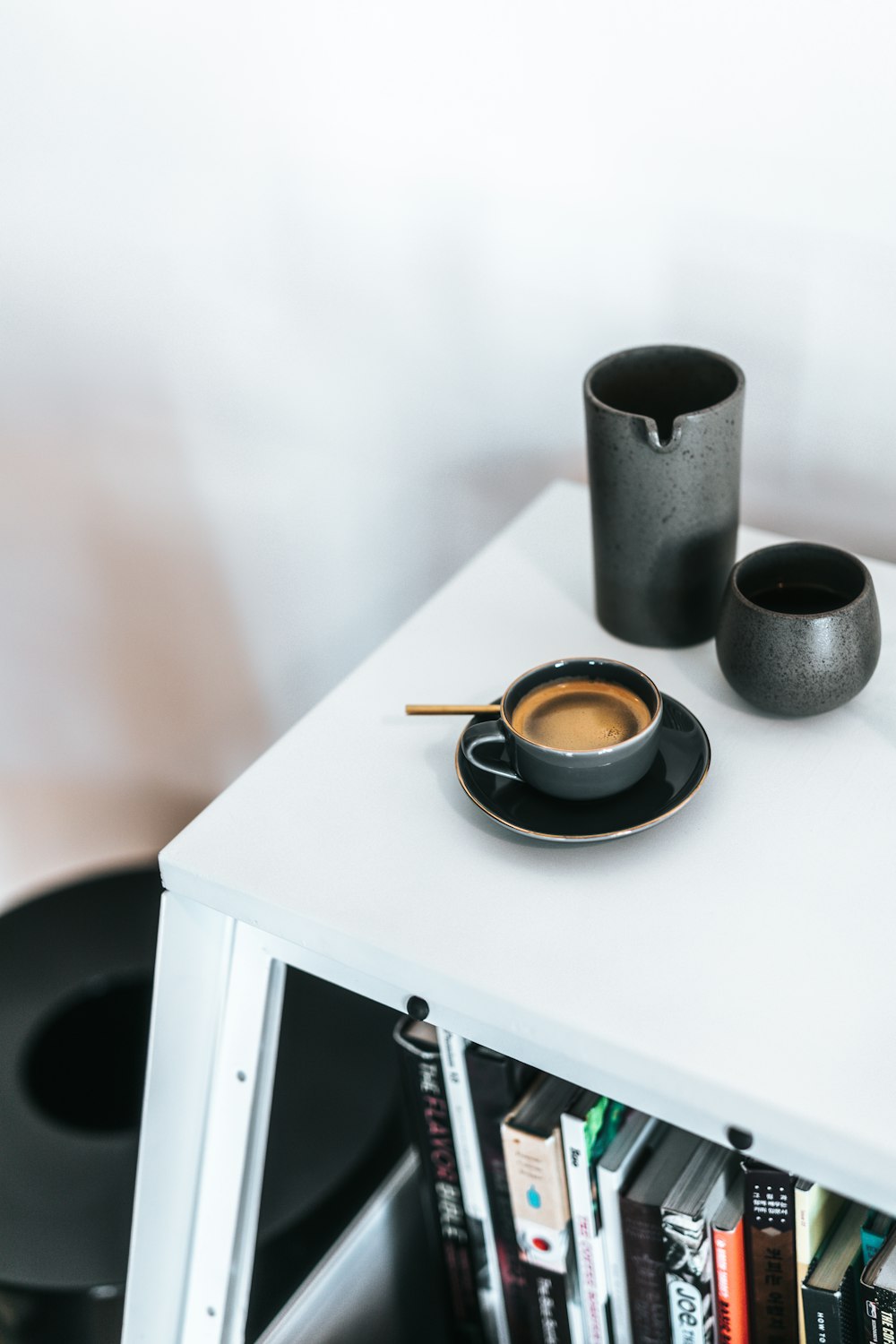 black ceramic teacup and saucer set