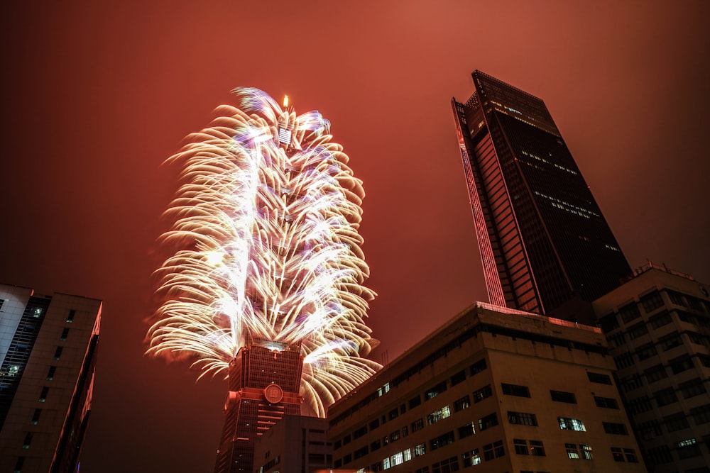 building with fireworks display during nighttime