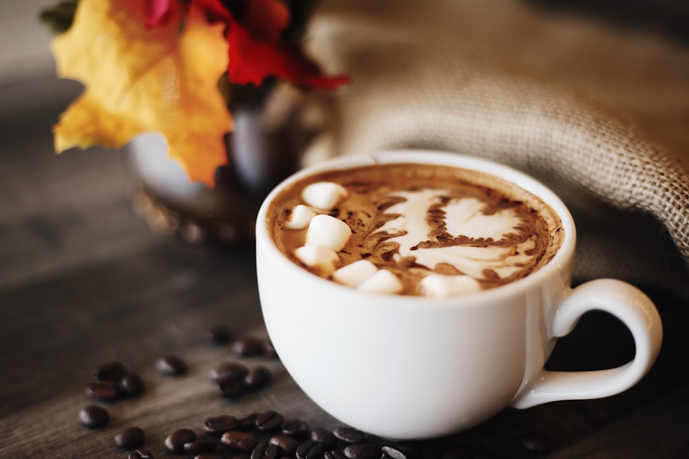 white ceramic coffee cup with cappuccino