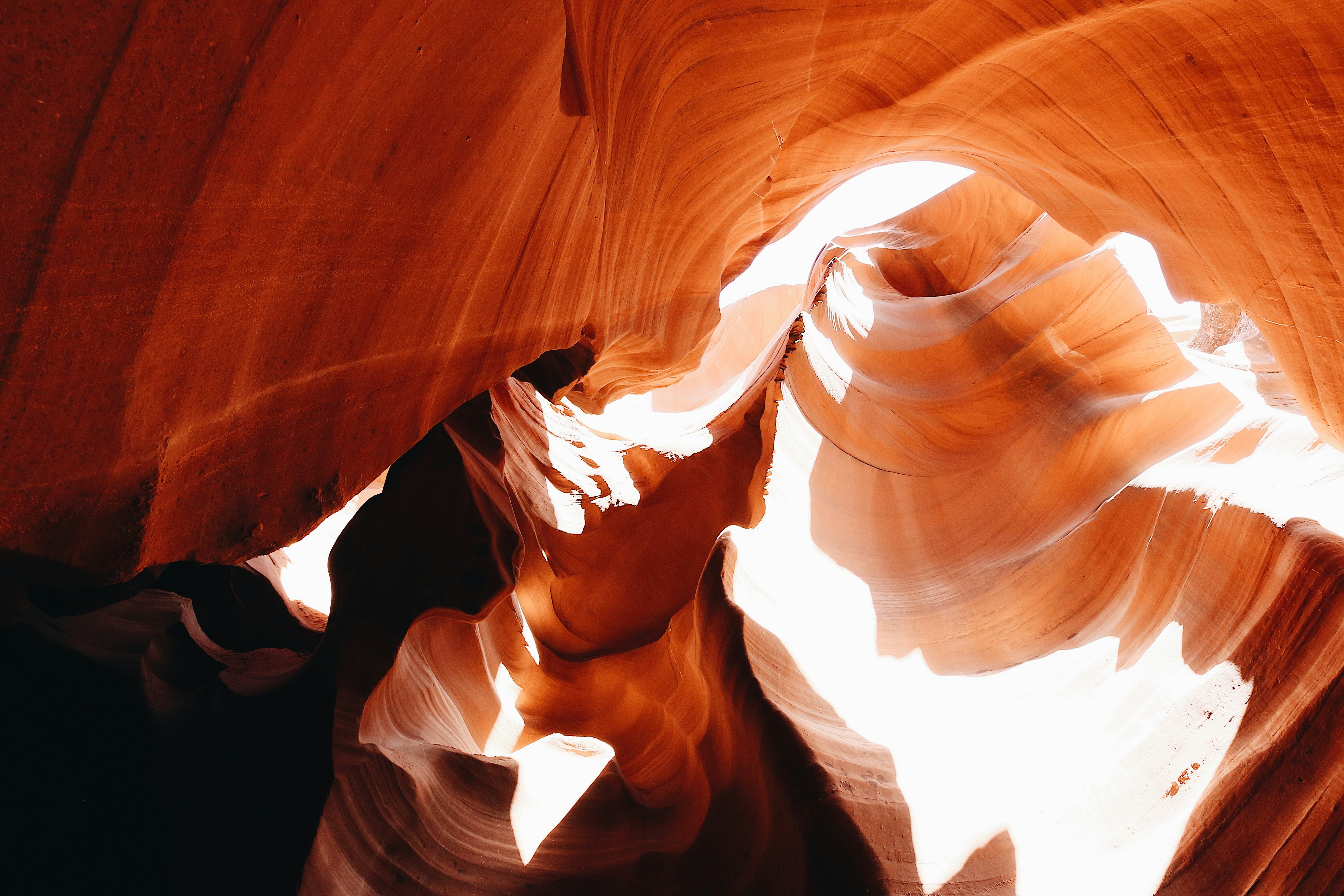 a narrow slot in the side of a canyon, Sunlight streaming into Antelope Canyon, AZ