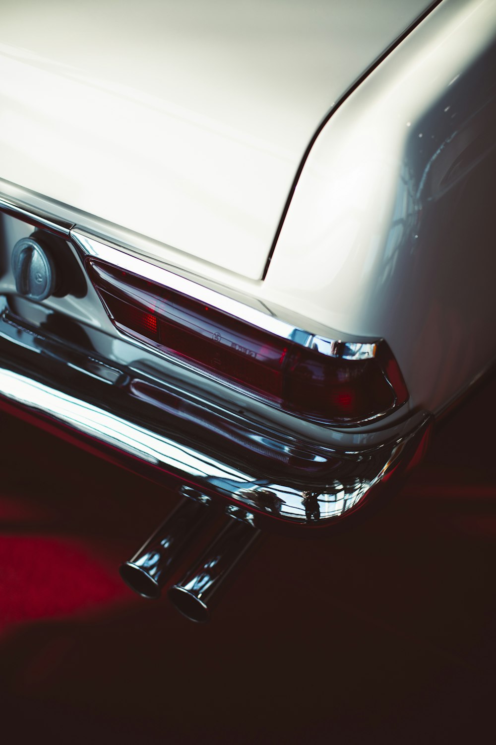 a close up of the tail lights of a classic car