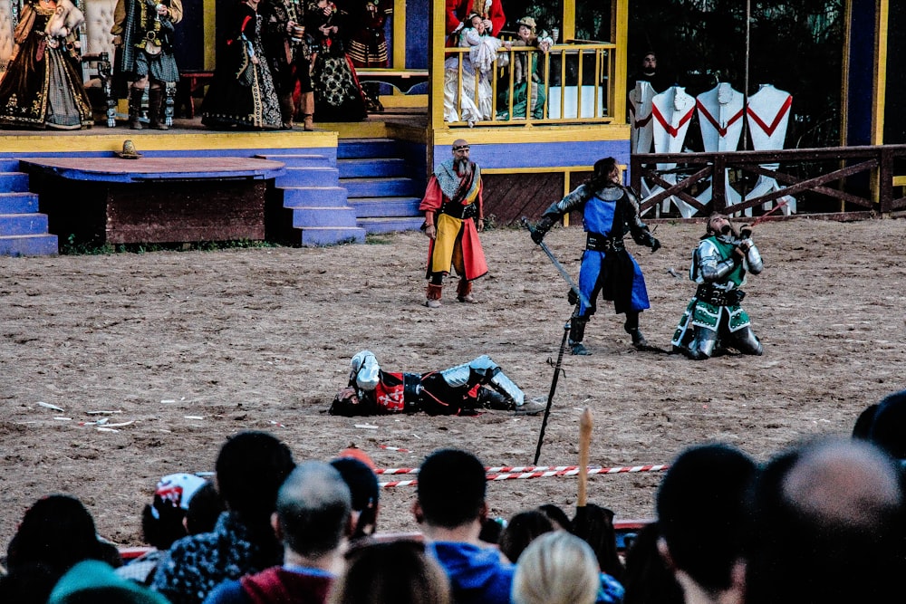 people playing historical play on field
