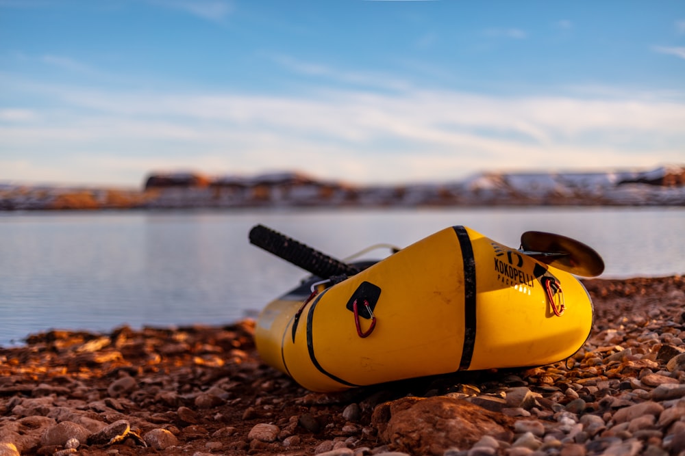 yellow kayak on shore