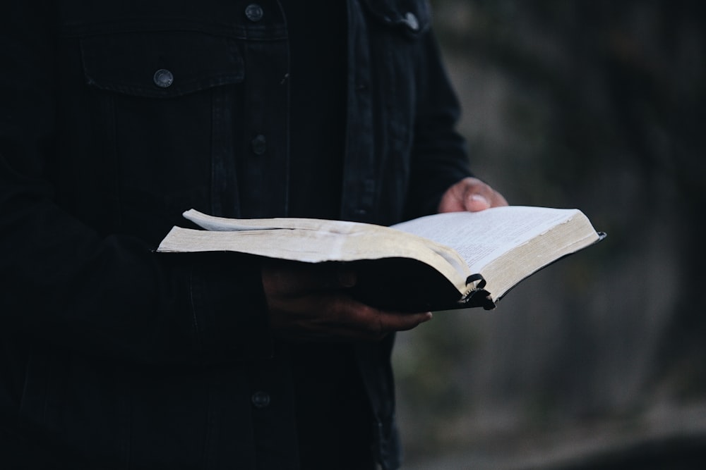 person holding book