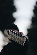 person holding book