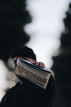 person holding book