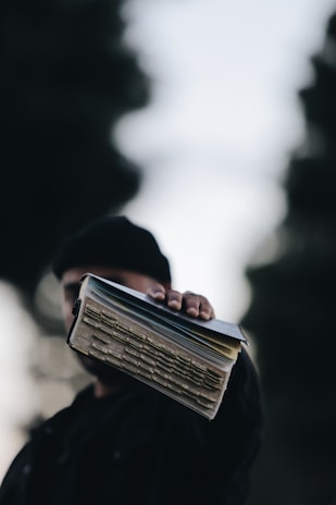person holding book
