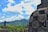 A scenic view of lush Sri Lankan hills with ancient ruins.
