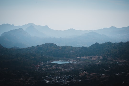 top view of mountains and town under gray sky in Mount Abu India