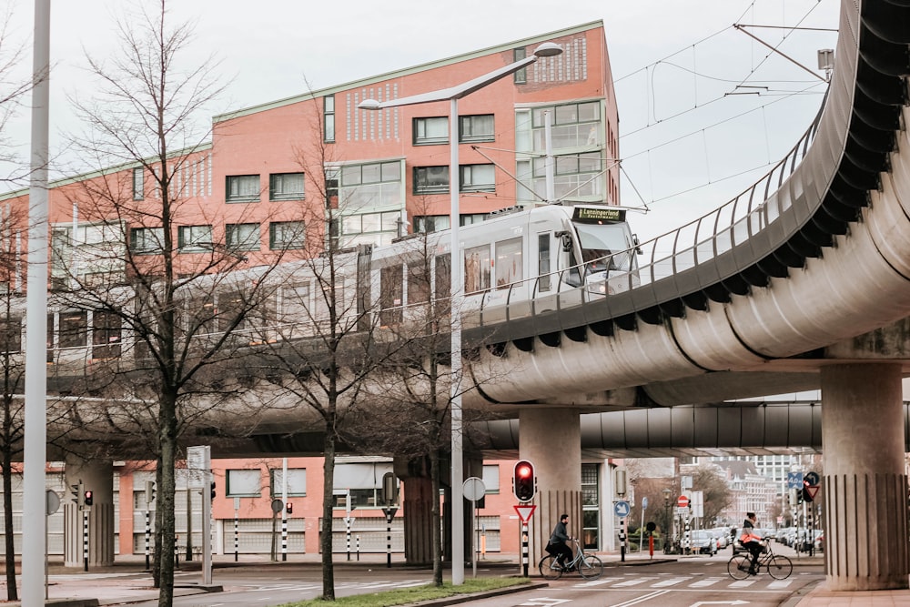 train passes by near apartment during daytime