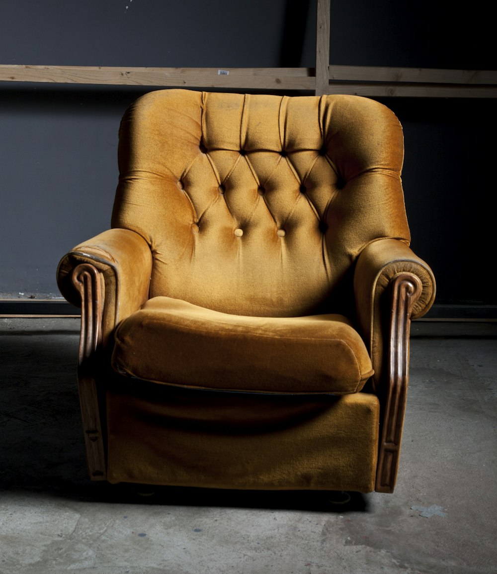 shallow focus photo of brown padded armchair