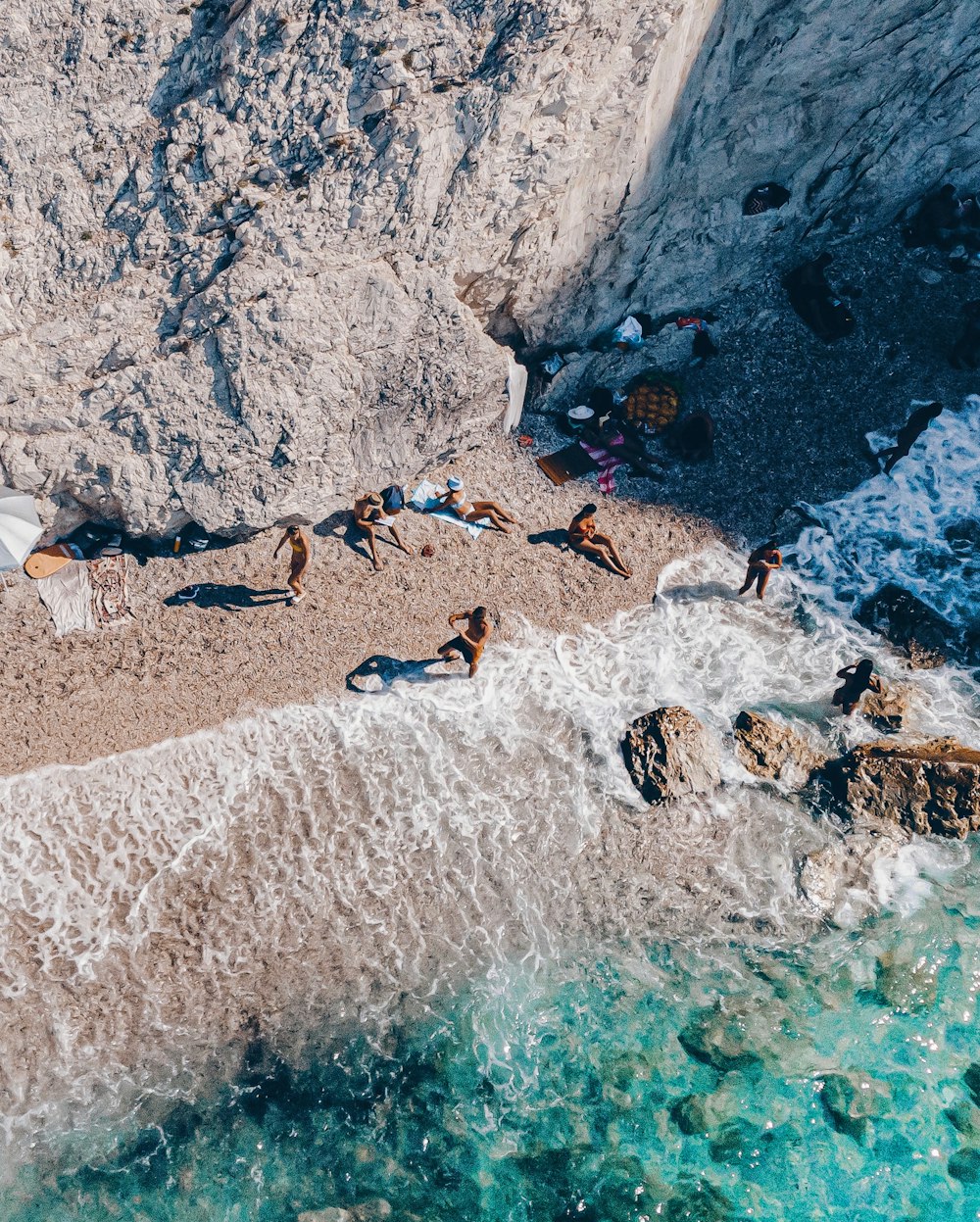 aerial photography of people on seashore during daytime