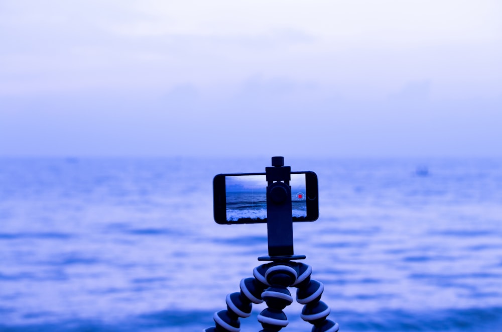 smartphone on octopus tripod facing sea