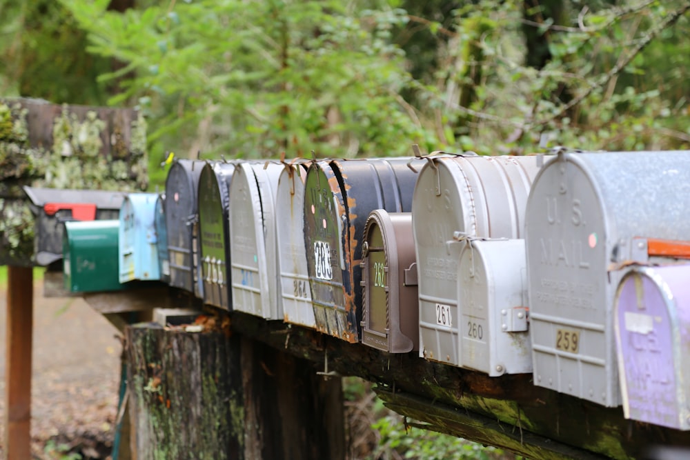 selective focus photography of gray mail boxes during daytime