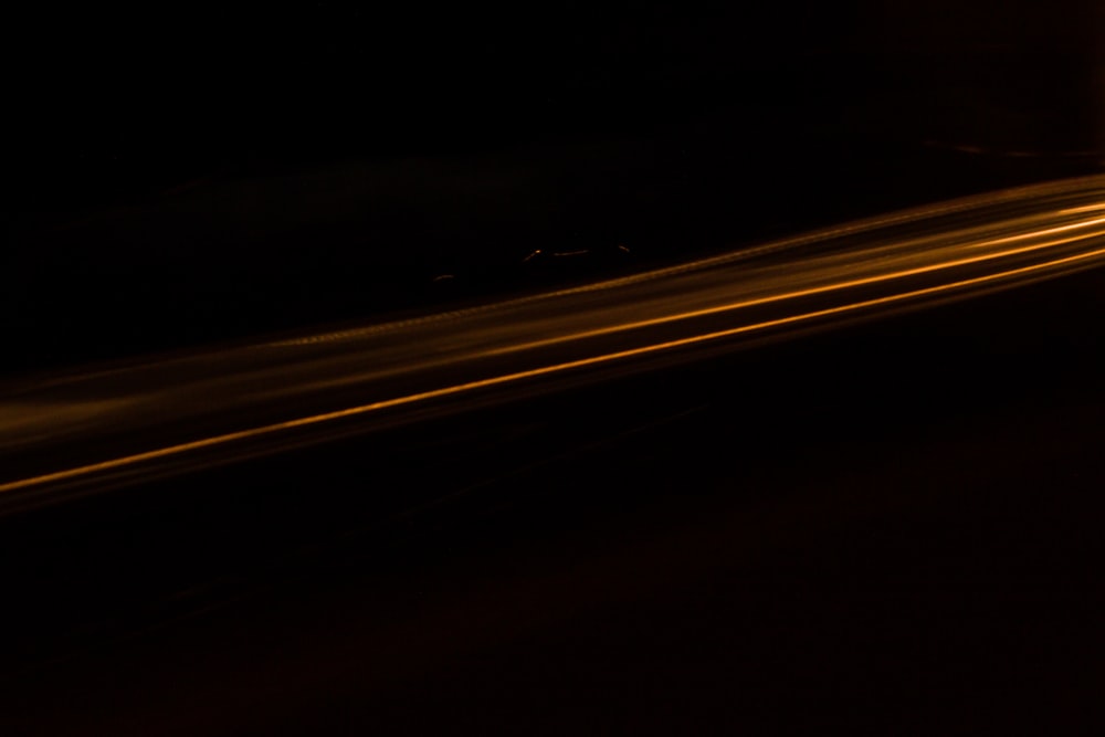 a blurry image of a street light in the dark