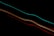 Bright, colorful light trails streak diagonally across a black background, creating a sense of motion and energy.