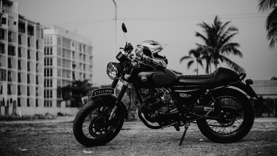 full-face helmet on parked standard motorcycle during day