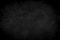a black and white photo of a dark background