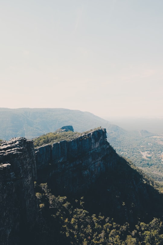 rocky cliff under white sky in Grampians National Park Australia