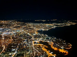 An aerial view of a city with digital connectivity lines.