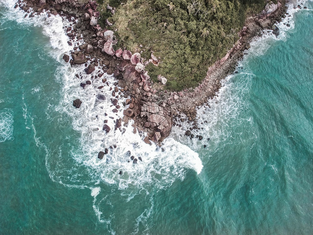 aerial view of rocks on shore