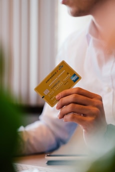 person holding credit card