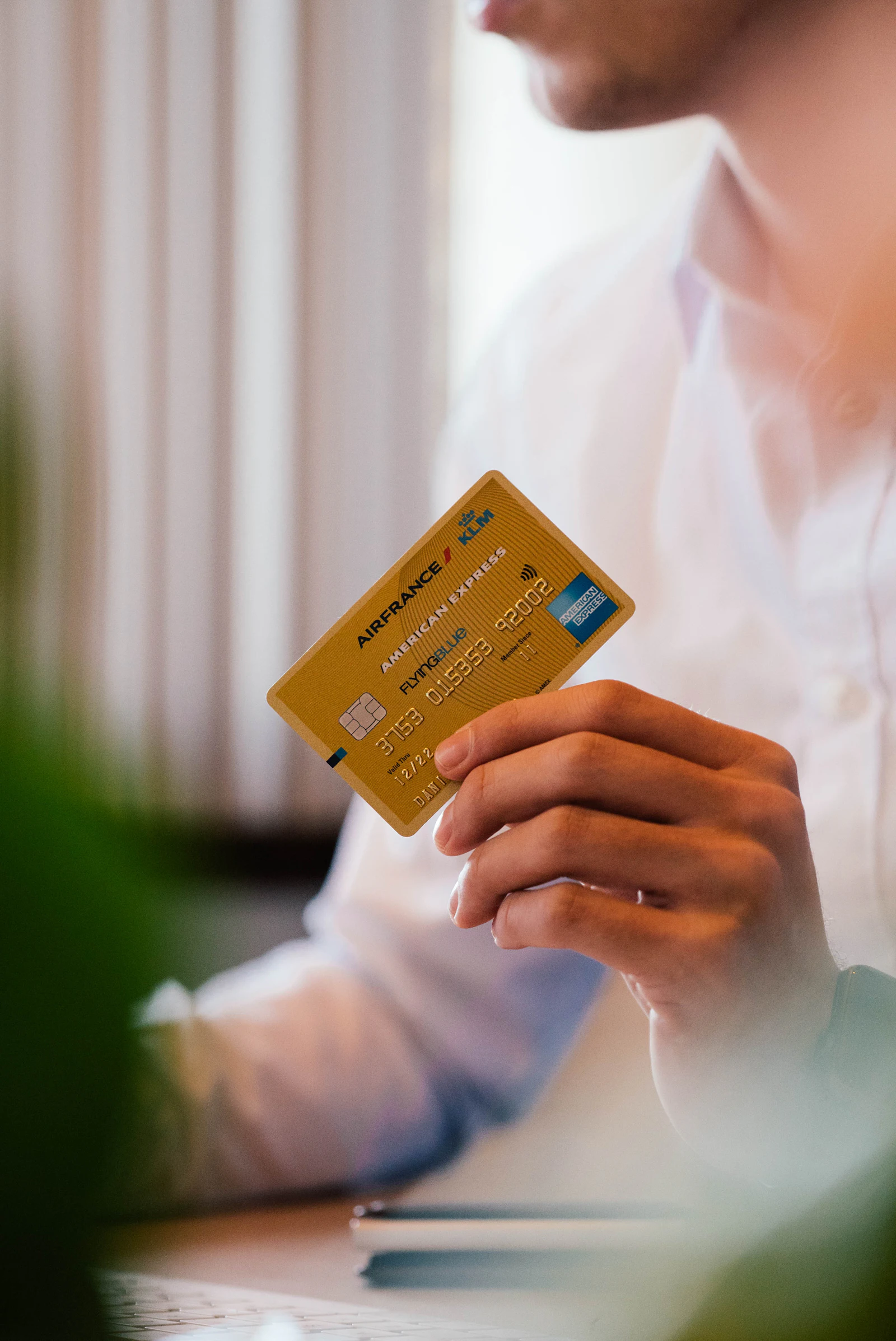 A person holding a credit card